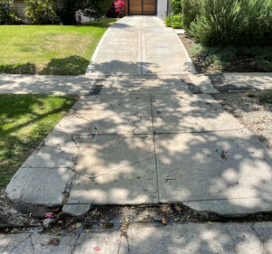 Woodland Hills Erosion under the sidewalk make concrete surface weak and break 